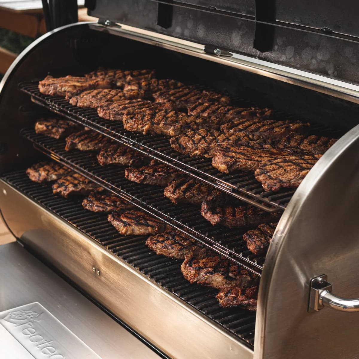 Three stainless racks of steaks inside an RT-2500 BFG