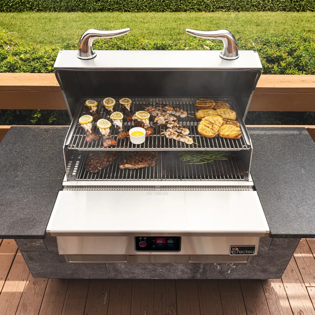 Shrimp, peppers, and squash on the grates of an E-Series Built-In